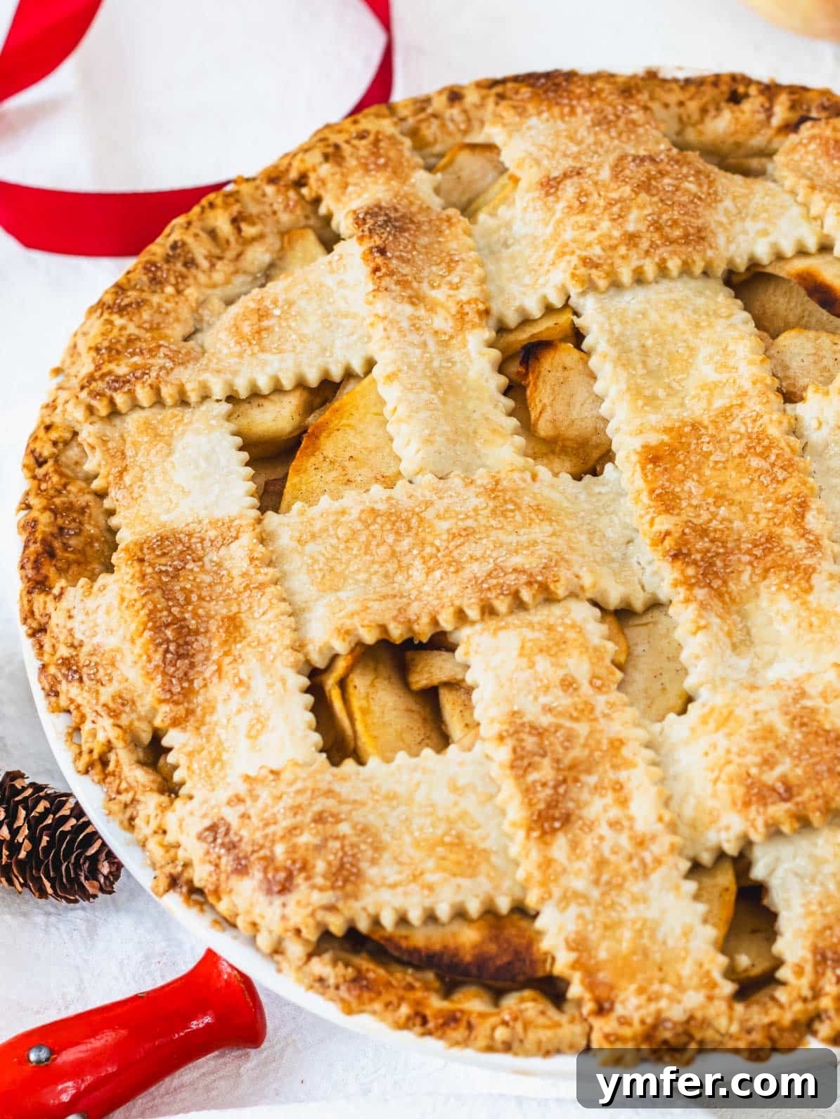 Plant-Based Apple Perfection 2 vegan apple pie with red ribbon