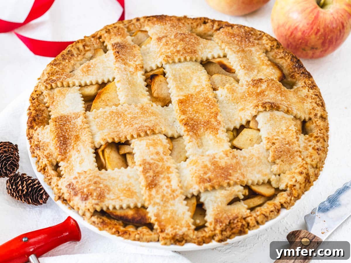 Plant-Based Apple Perfection 5 vegan apple pie with red apples and knife on the side