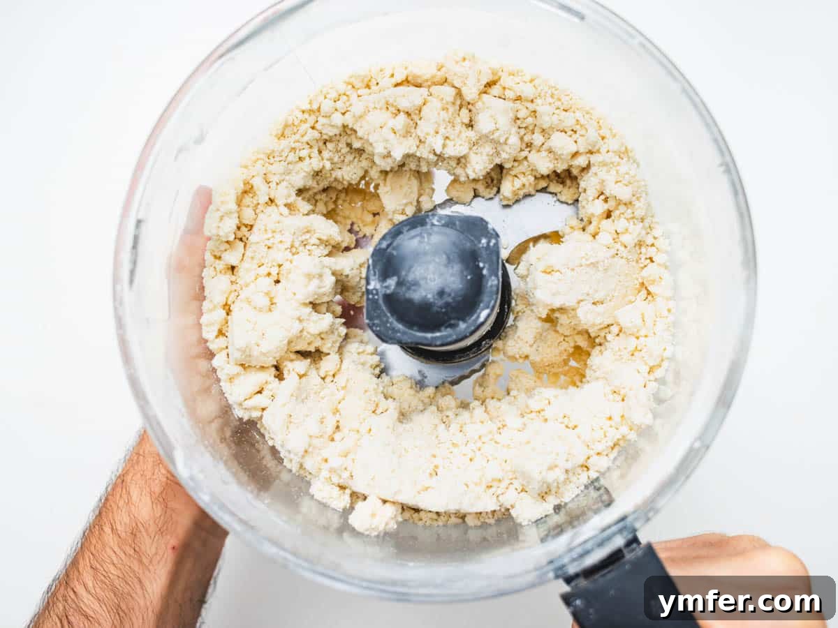 Plant-Based Apple Perfection 6 vegan pie crust in a food processor after blending