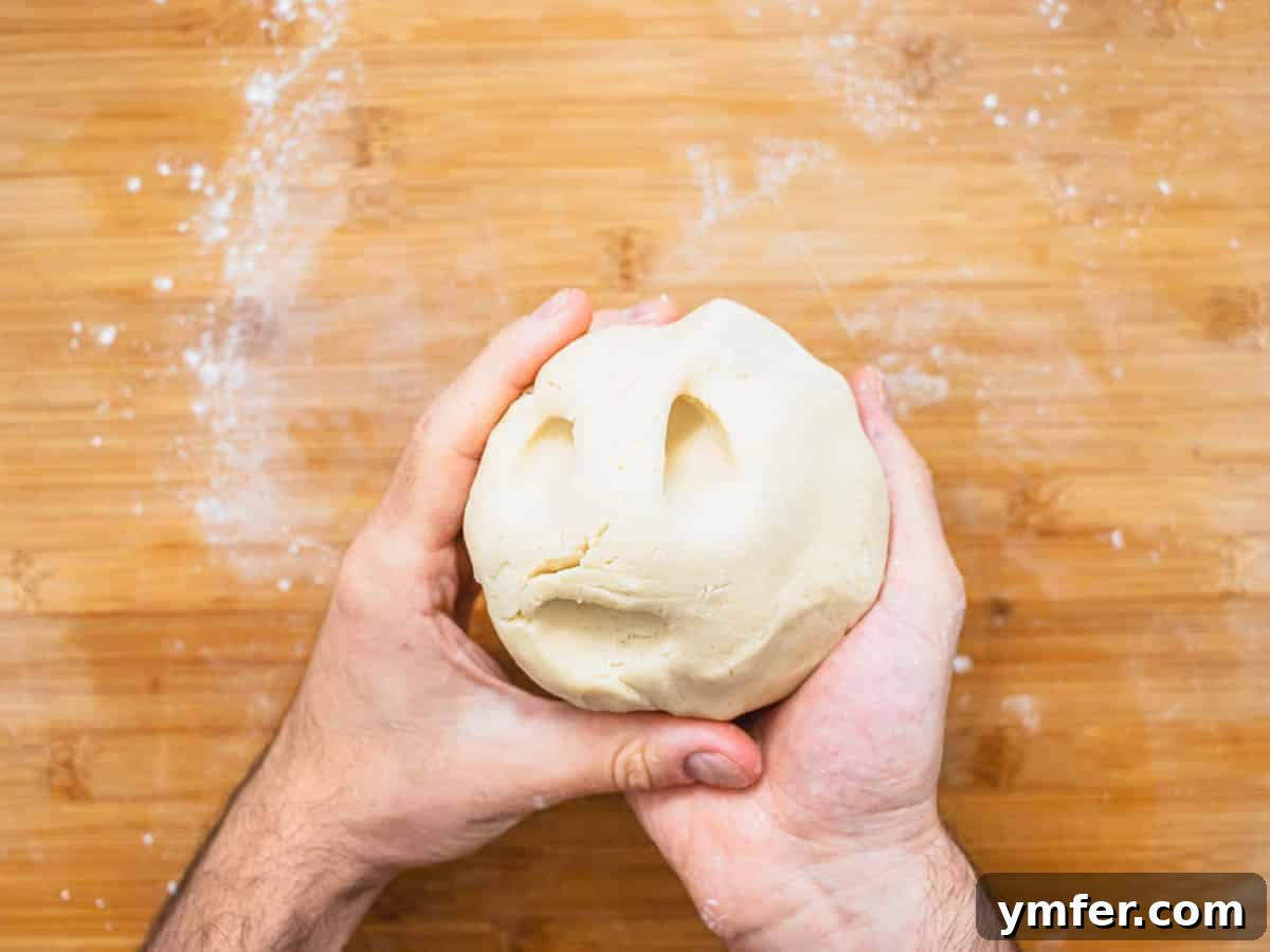 Plant-Based Apple Perfection 7 vegan pie crust with hands and flour