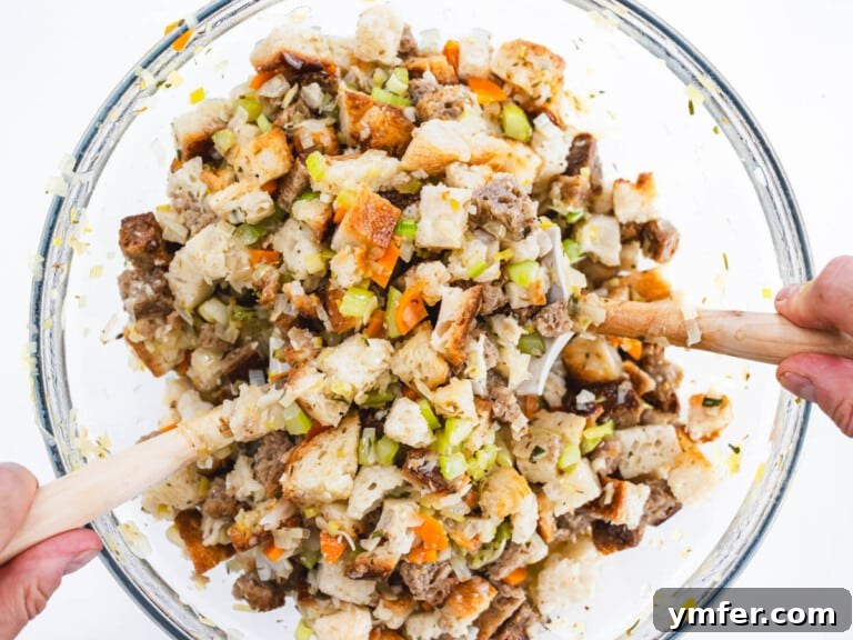hands mixing breadcrumbs and flavor base in a bowl