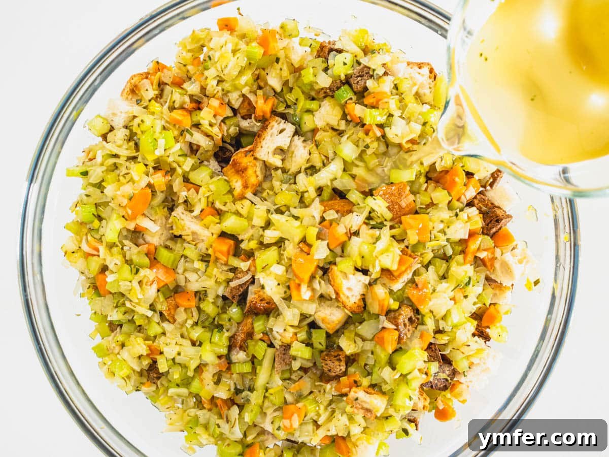 Savory Plant-Based Dressing 9 vegetable broth pours into breadcrumbs