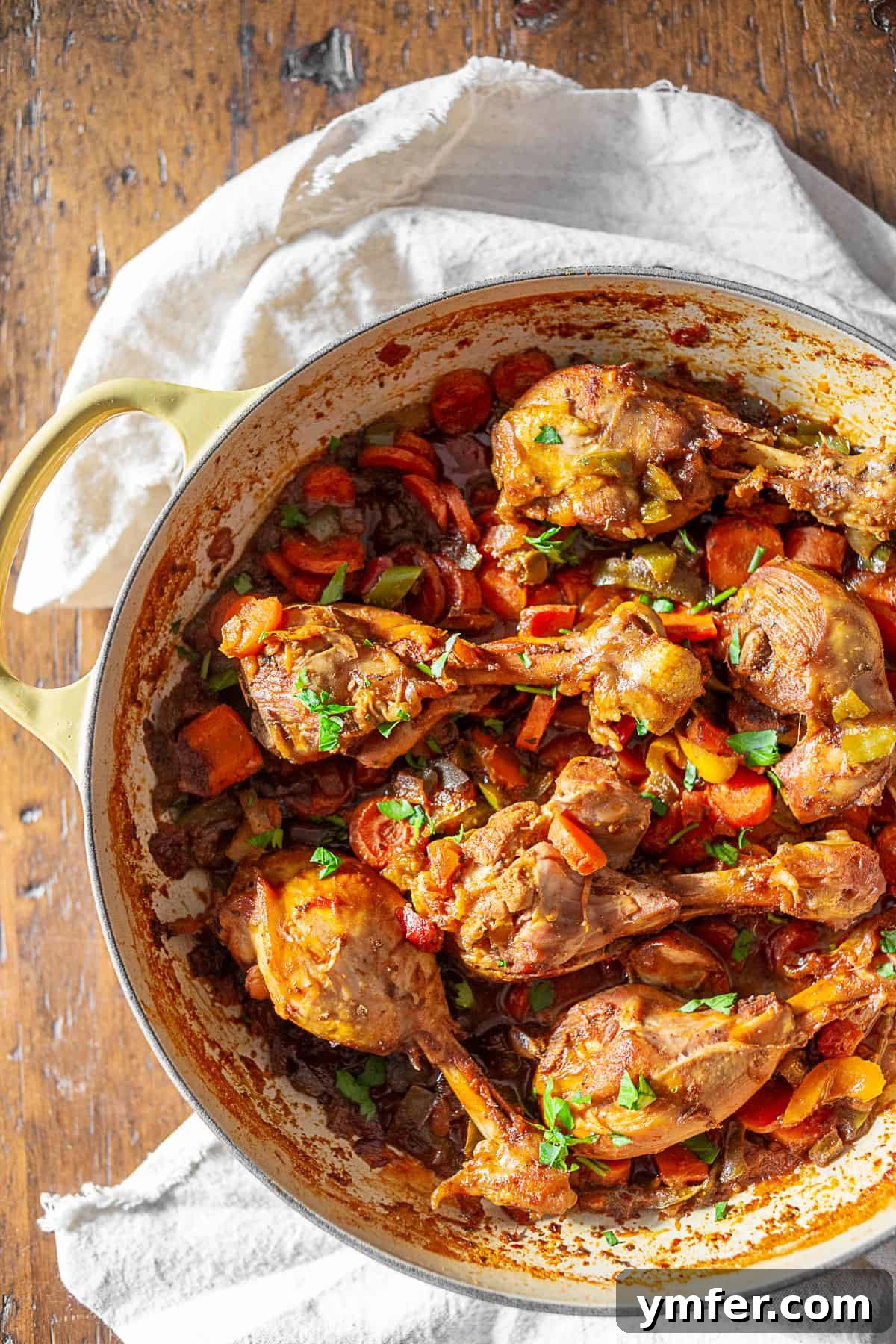 Hearty Grenadian Chicken Pot 3 A round casserole dish filled with rich Grenadian Chicken Stew, ready to be served.