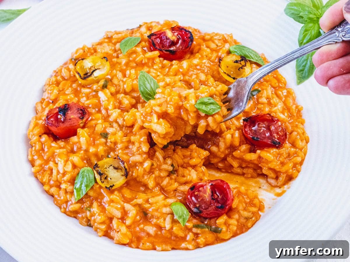 Sun-Kissed Tomato Risotto 11 Tomato risotto with charred cherry tomatoes and a fork