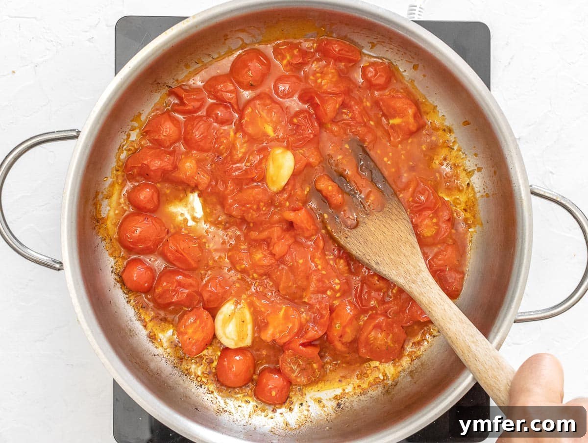 Sun-Kissed Tomato Risotto 13 crush tomatoes with fork