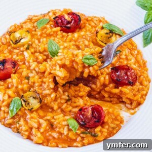 tomato risotto with silver fork and blistered tomatoes