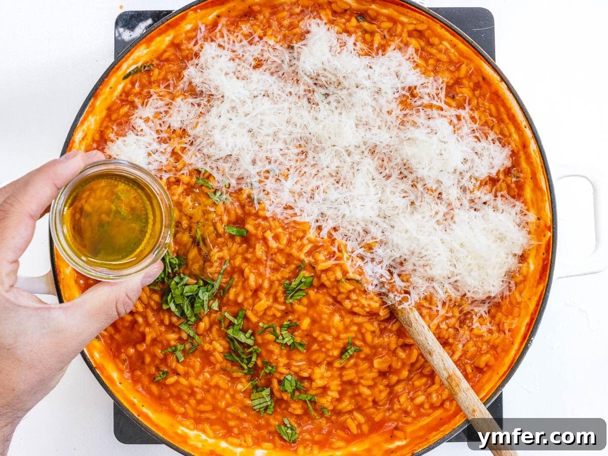Sun-Kissed Tomato Risotto 9 parmesan cheese and oil added to tomato risotto