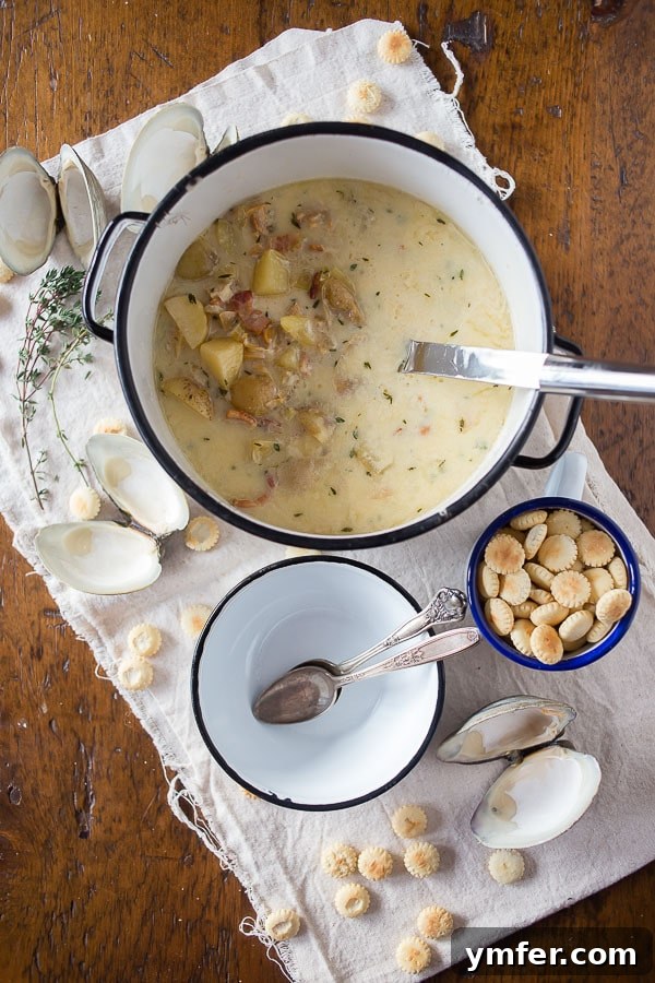 Creamy Atlantic Comfort 2 New England Clam Chowder in a large pot, ready to be served. A classic winter soup.