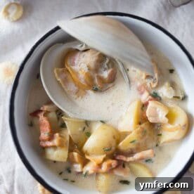 This homemade New England Clam Chowder is easily made with fresh clams, cream, and buttery potatoes. It's the perfect winter soup.