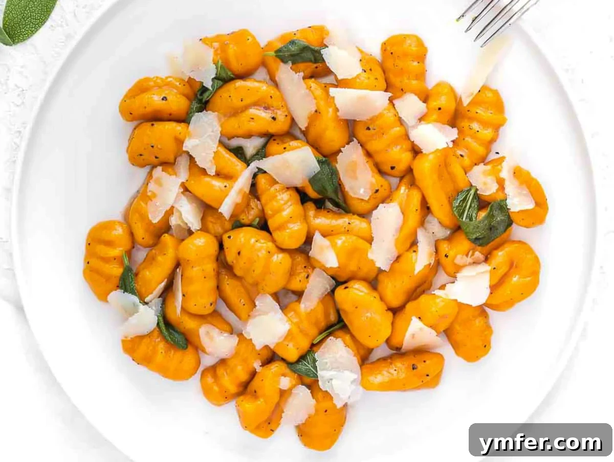 Egg-Free Delights 13 Vibrant sweet potato gnocchi with sauce and shaved parmesan