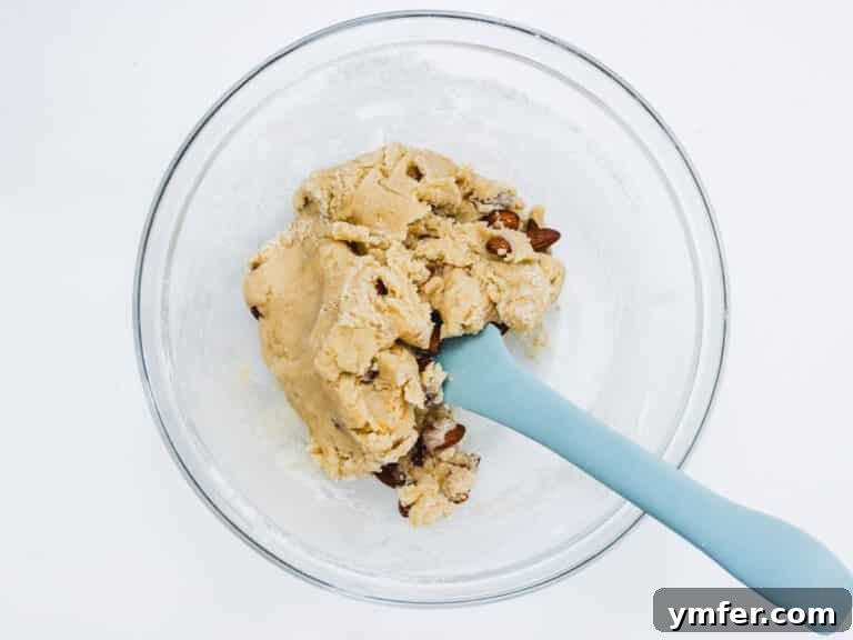 Dry ingredients and almonds combined in a glass bowl