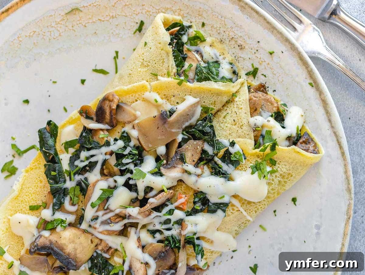 Egg-Free Delights 5 Savory chickpea crepes filled with greens on a plate