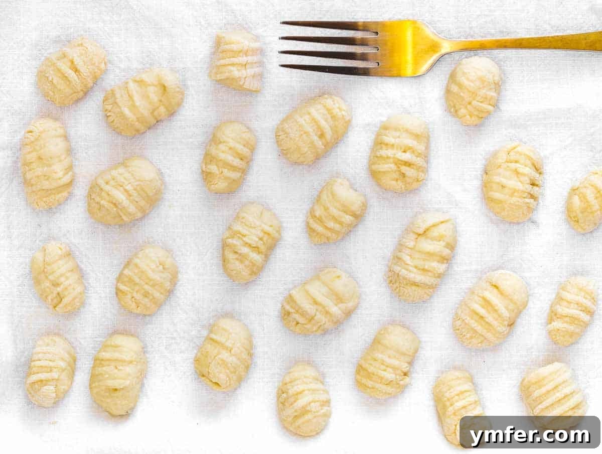 Egg-Free Delights 9 Handmade gnocchi being shaped with a fork