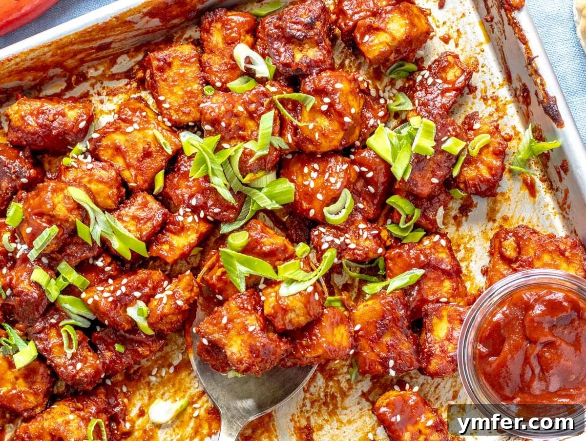 30 Plant-Based Protein Power Meals 13 BBQ tofu on a baking tray with scallions