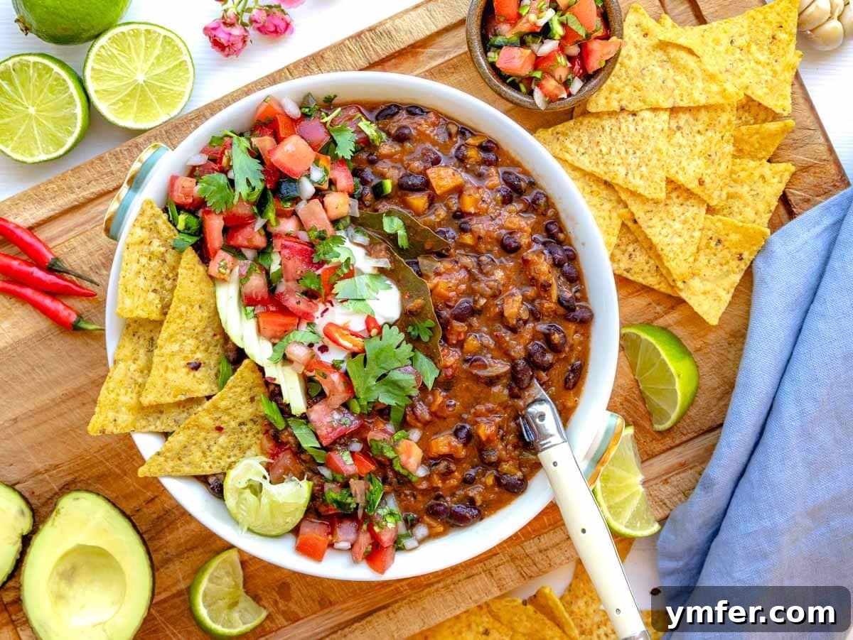 30 Plant-Based Protein Power Meals 16 black bean soup with nachos and a spoon