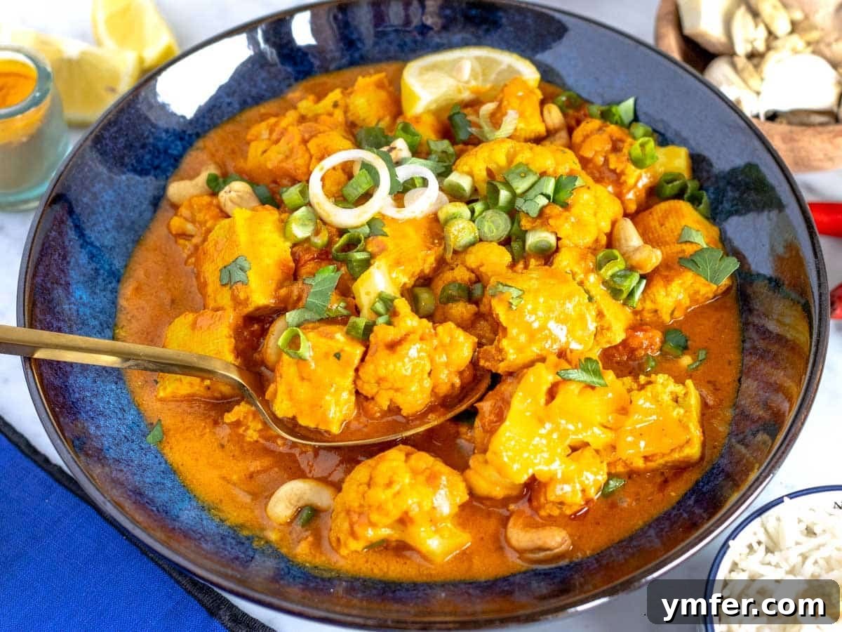 30 Plant-Based Protein Power Meals 3 Tofu and cauliflower curry in a bowl.