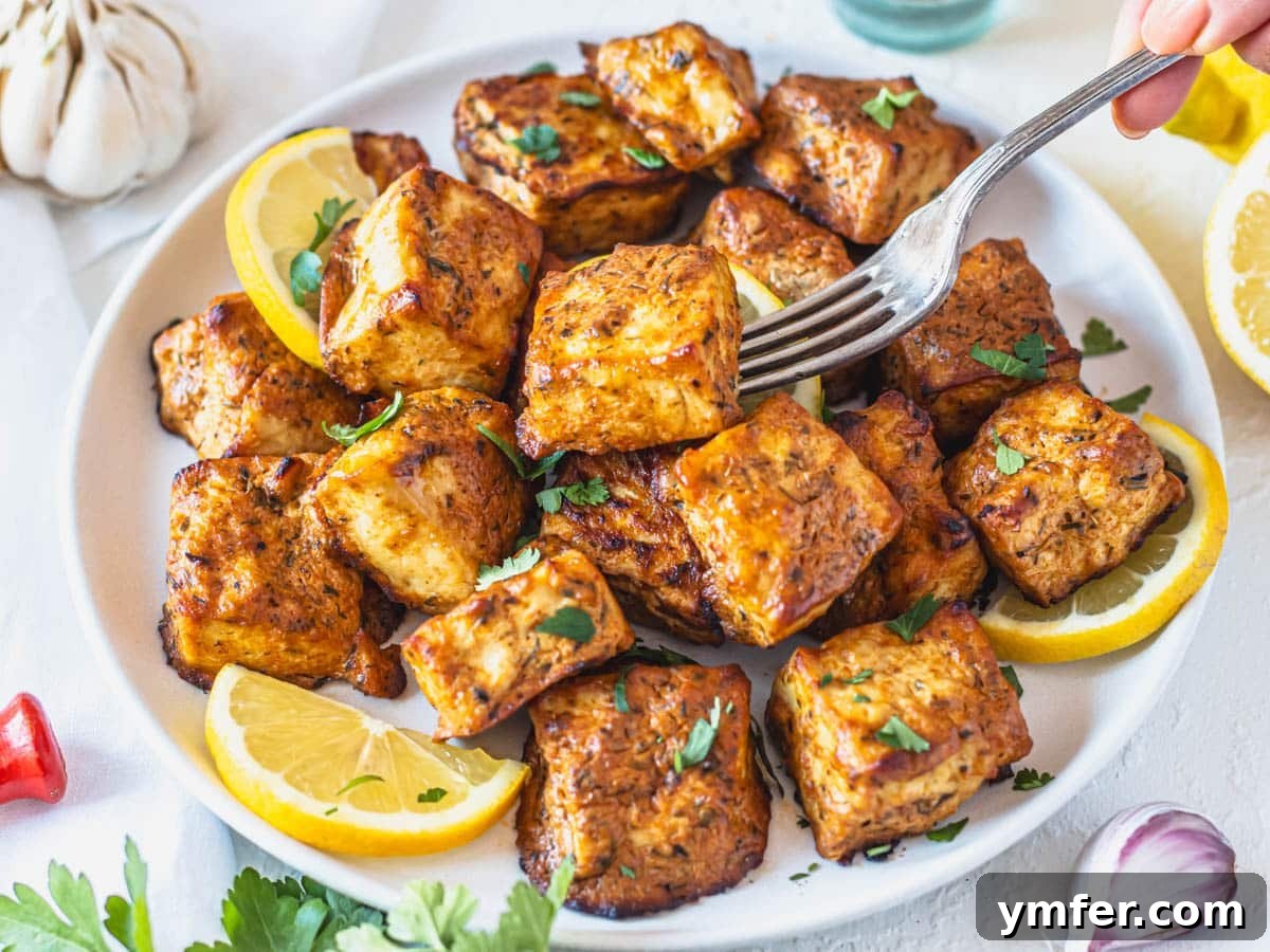 30 Plant-Based Protein Power Meals 24 Marinated tofu with lemon and parsley and a silver fork