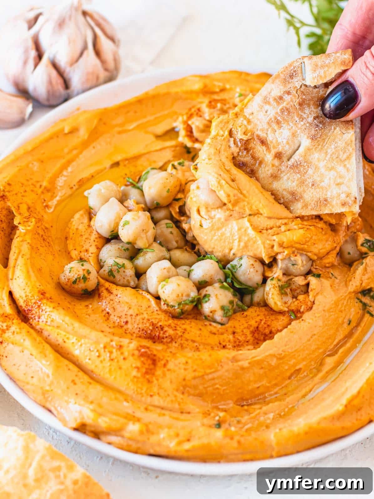 Velvety Roasted Red Pepper Hummus 2 Vibrant homemade roasted red pepper hummus, creamy and ready to serve.