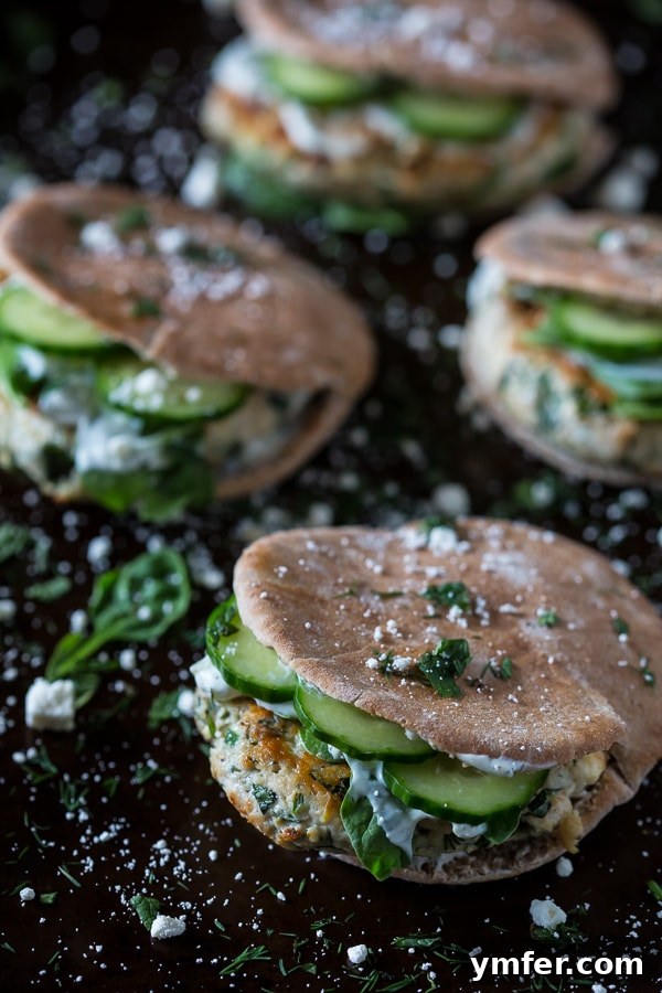 Mediterranean Chicken Souvlaki Burgers 4 Four chicken souvlaki burgers with cucumbers in pita pockets, ready to serve
