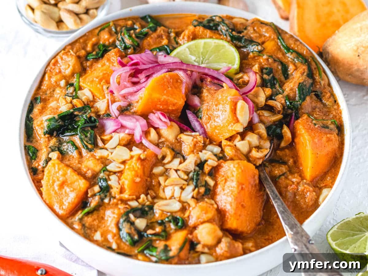 Soulful African Peanut Stew 4 African peanut stew with spinach and sweet potato in a white bowl