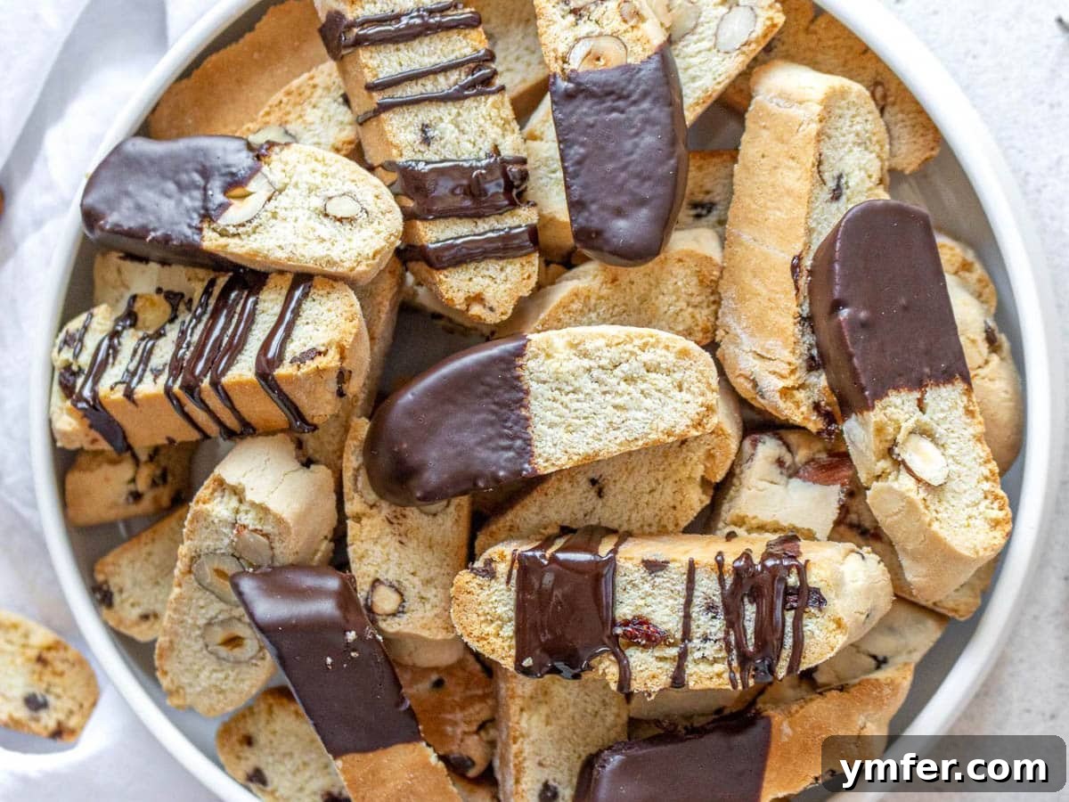 Twice Baked Italian Delights 17 Elegant biscotti partially dipped in rich dark chocolate, showcasing a decadent variation.