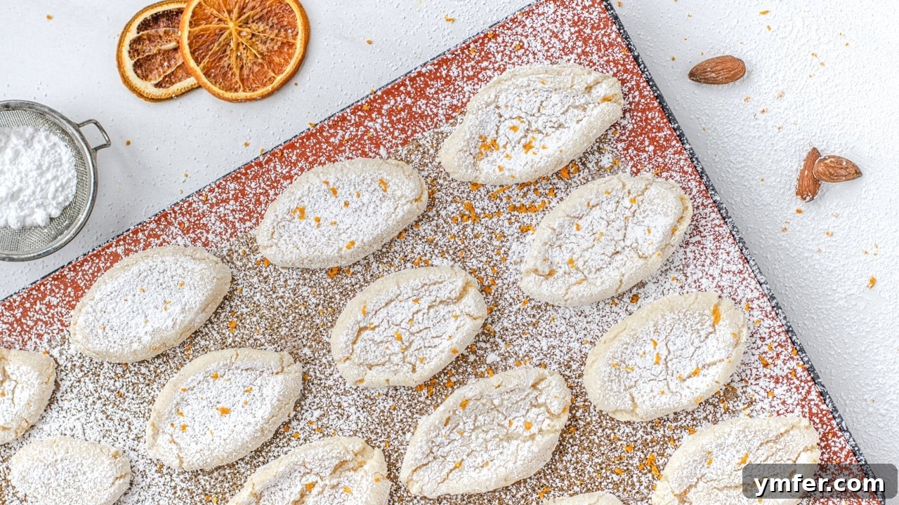 Zesty Orange Almond Delights 3 Close-up of soft and chewy vegan orange almond cookies, also known as Ricciarelli.