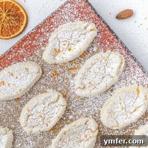 Zesty Orange Almond Delights 5 Perfectly baked vegan orange almond cookies, also known as Ricciarelli.
