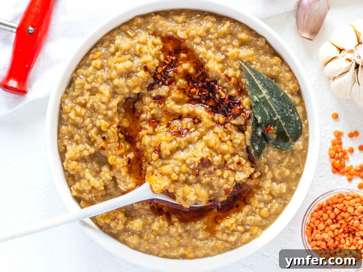 Perfect Red Lentils Every Time 9 Cooked red lentils served in a bowl with chili oil, demonstrating a delicious presentation