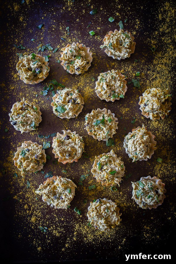 Golden Curry Chicken Salad Phyllo Tartlets 2 These little curried chicken salad phyllo cups are packed full of Greek yogurt, curry spice, cilantro and green onions. Then it's all packed into a crunchy phyllo cups for the perfect party appetizer.