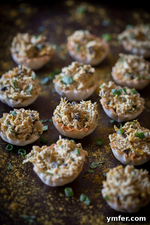 Golden Curry Chicken Salad Phyllo Tartlets 4 These little curried chicken salad phyllo cups are packed full of Greek yogurt, curry spice, cilantro and green onions. Then it's all packed into a crunchy phyllo cups for the perfect party appetizer. So simple and ready in under 30 minutes!