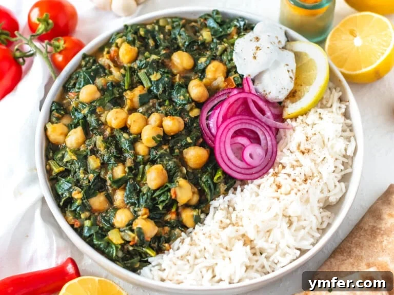 Spiced Chickpea and Spinach Curry 14 A bowl of Chana Saag served with basmati rice and pickled onions.