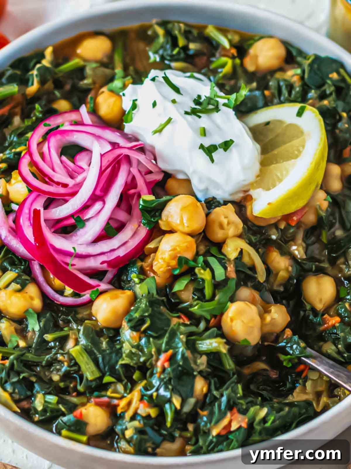 Spiced Chickpea and Spinach Curry 9 A beautifully plated bowl of chickpea and spinach curry, ready to be served, emphasizing its vibrant colors and inviting texture.