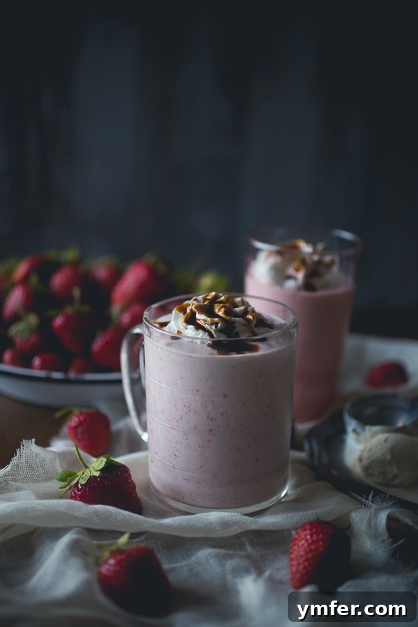 Velvet Strawberry Fraiche Shake 2 Exquisite Strawberry Crème Fraîche Milkshake with a glossy balsamic drizzle, ready for a refreshing summer sip on a porch.