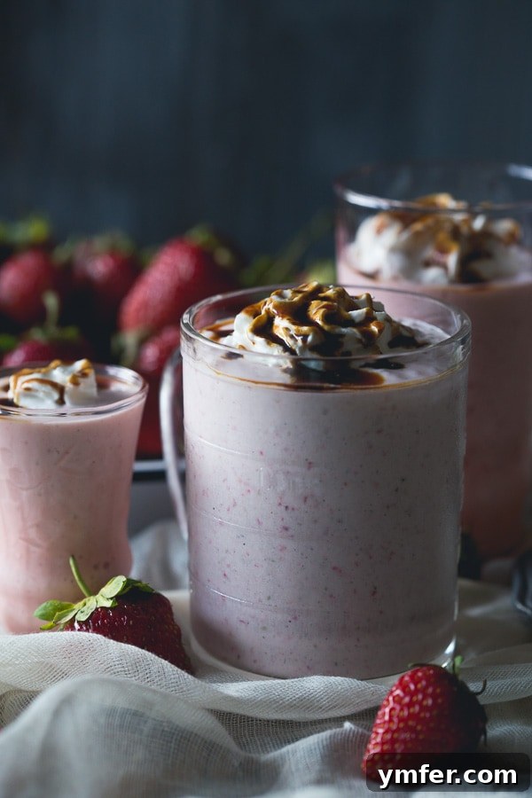 Velvet Strawberry Fraiche Shake 5 A refreshing Strawberry Crème Fraîche Milkshake, beautifully presented with a rich balsamic drizzle and whipped cream, inviting a taste of summer.