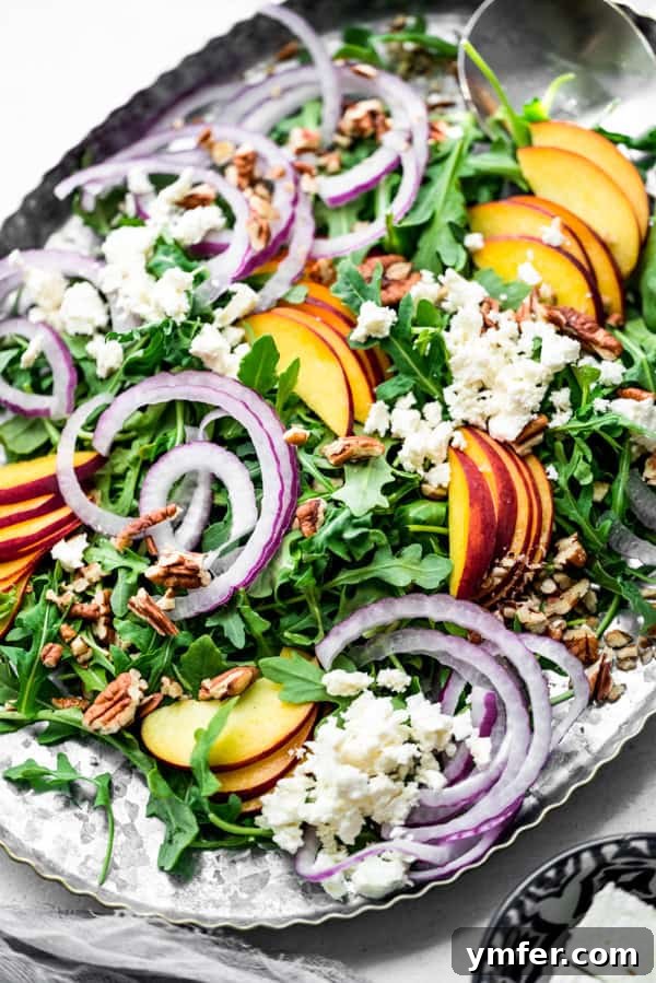 Sweet and Savory Peach Feta 2 Peach Feta Salad on a salad serving dish, showcasing vibrant colors.