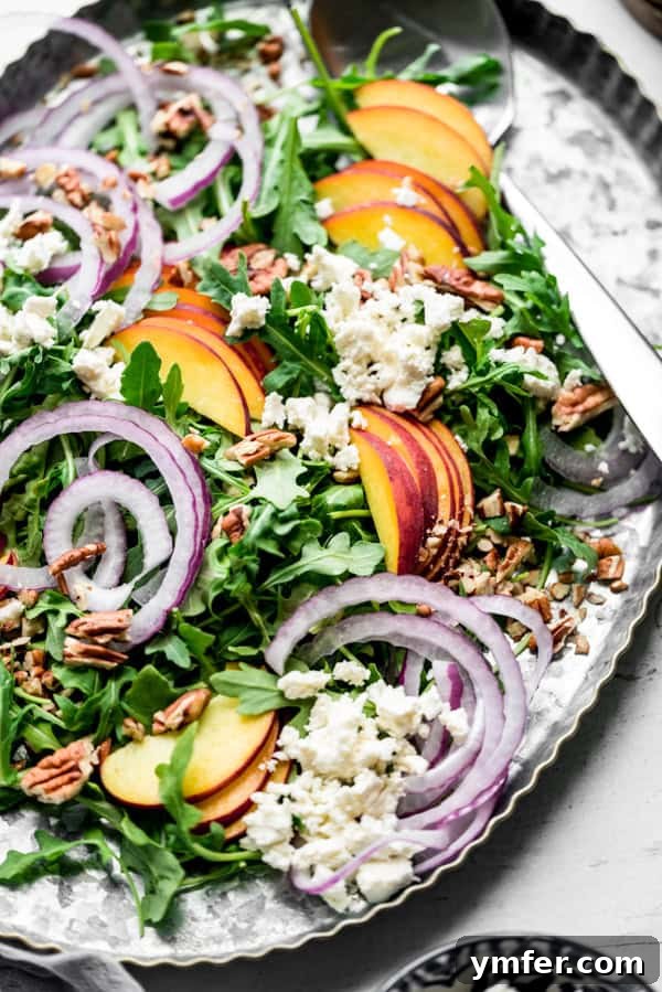 Sweet and Savory Peach Feta 5 A large peach feta salad presented beautifully on a big serving tray.