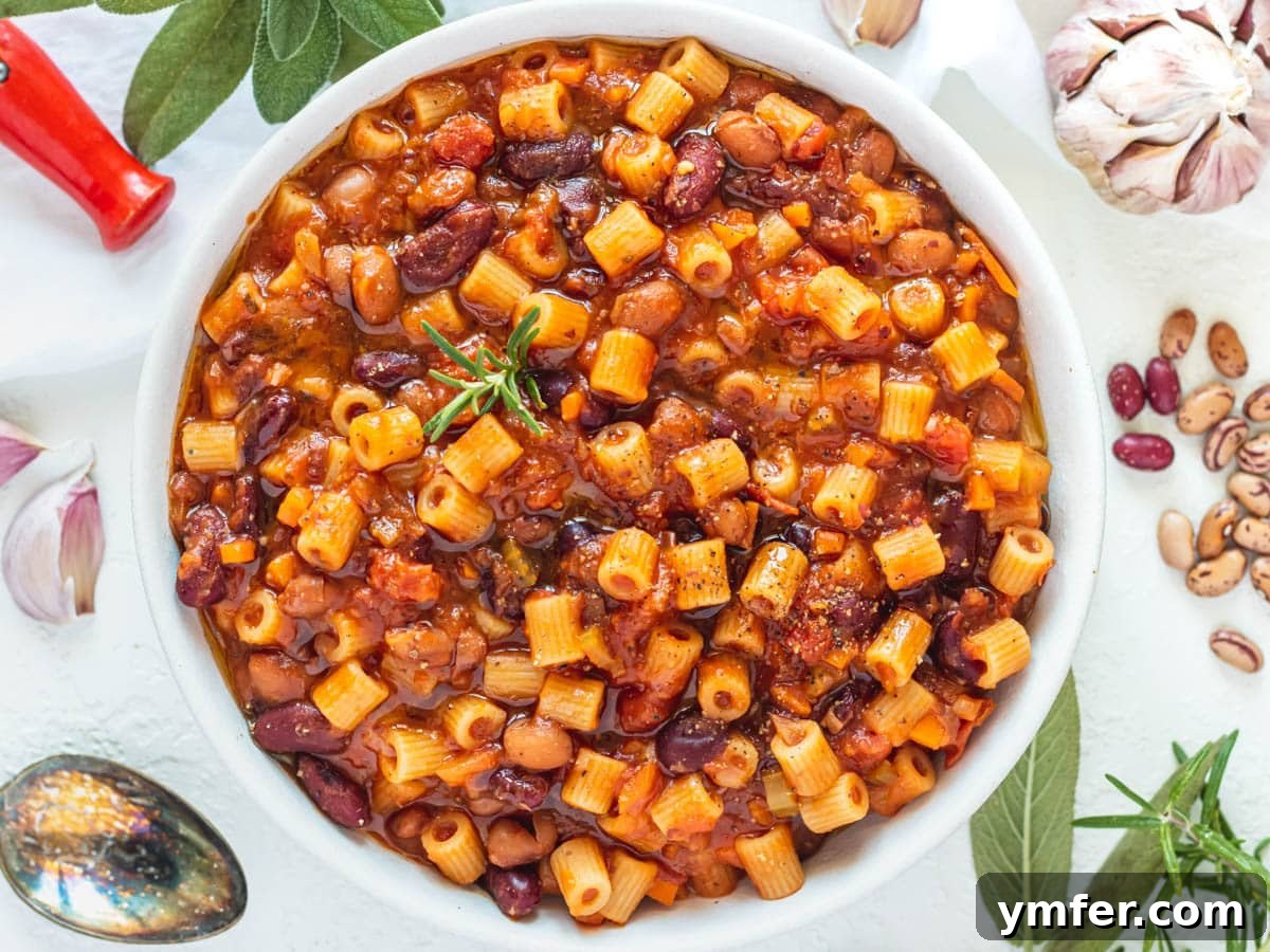 Simple Celery Recipes 22 Heartwarming Pasta e Fagioli, garnished with fresh garlic and aromatic herbs.