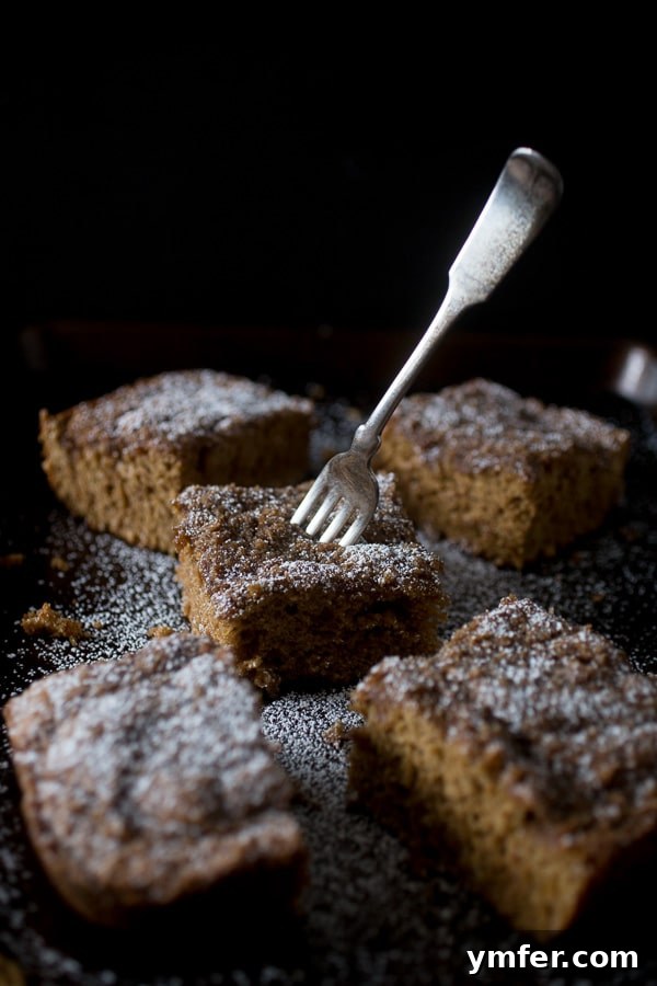Spiced Zucchini Coffee Cake 4 A whole Zucchini Coffee Cake with a generous streusel topping, cooling on a wire rack.