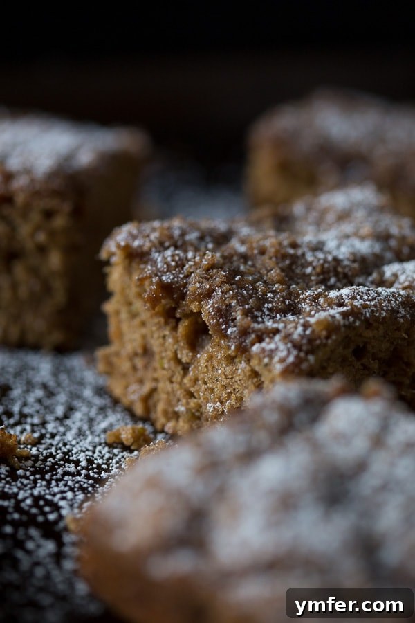 Spiced Zucchini Coffee Cake 5 A close-up shot of the tender, moist interior of Zucchini Coffee Cake with visible specks of zucchini.