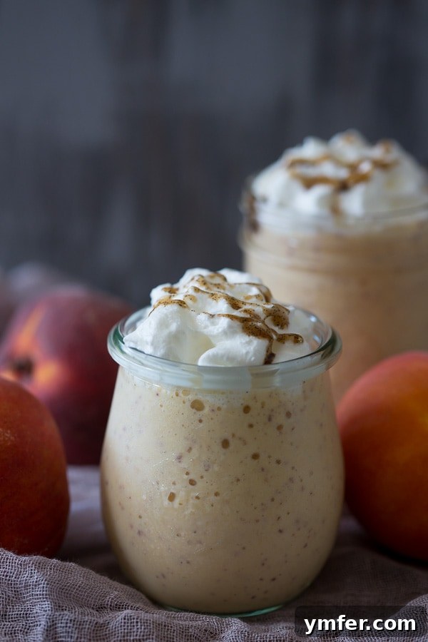 Velvet Bourbon Peach Swirl 2 Refreshing Vanilla Peach Bourbon Milkshake with fresh peaches and creamy vanilla ice cream, perfect for summer.