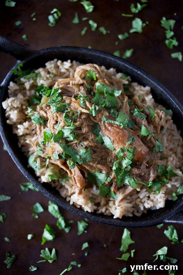 Tender Slow Cooker Honey Mustard Pulled Pork 2 Slow Cooker Honey Mustard Pulled Pork in a rustic dish, ready to be served.