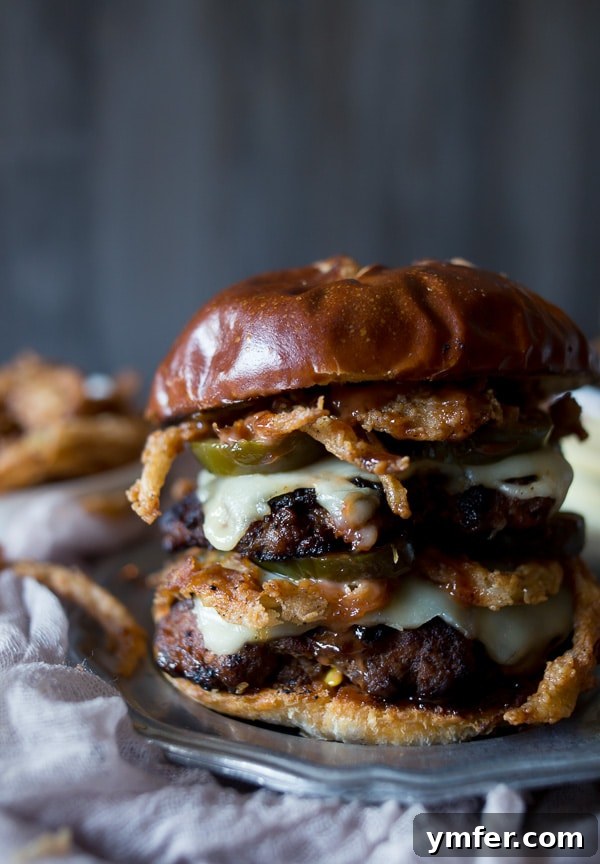 Crispy Onion Chorizo Burgers 2 This chorizo beef burger with crispy onion straws is the perfect big mouth burger. Topped with bbq fry sauce, candied jalapeños and American cheese.