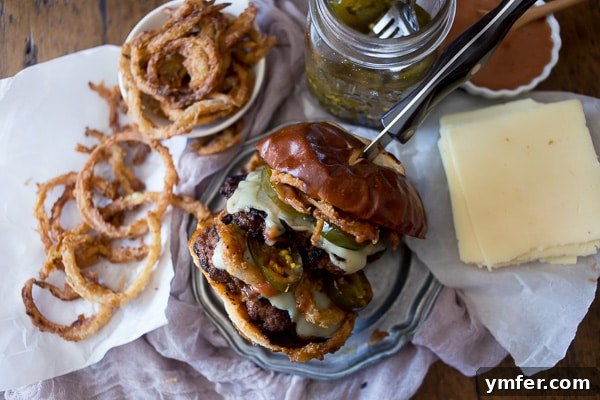Crispy Onion Chorizo Burgers 3 This chorizo beef burger with crispy onion straws is the perfect big mouth burger. Topped with bbq fry sauce, candied jalapeños and American cheese.