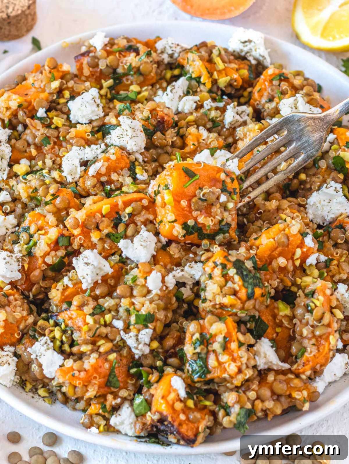 Wholesome Quinoa Lentil Delight 2 Quinoa lentil salad with crumbled feta, presented beautifully on a serving platter.