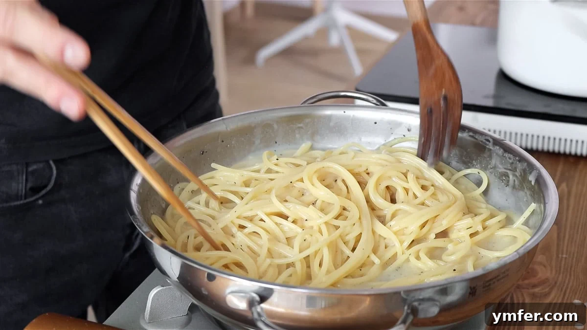 Creamy Vegan Pepper Pasta 12 Vegan Cacio e Pepe, almost ready, perfectly coated in the rich, creamy sauce.