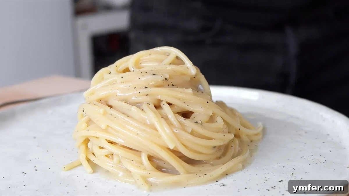 Creamy Vegan Pepper Pasta 13 A beautifully presented plate of Vegan Cacio e Pepe, ready to be served.