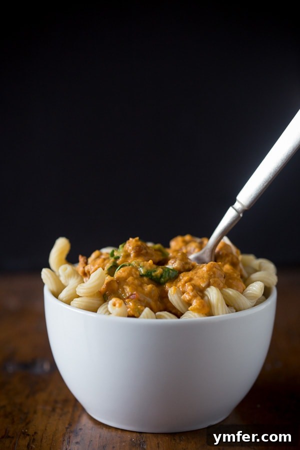 Rustic Spicy Pumpkin Sausage Sauce 5 A large skillet filled with the finished spicy sausage pumpkin pasta sauce, showing its inviting texture and warmth, ready to be served family-style.