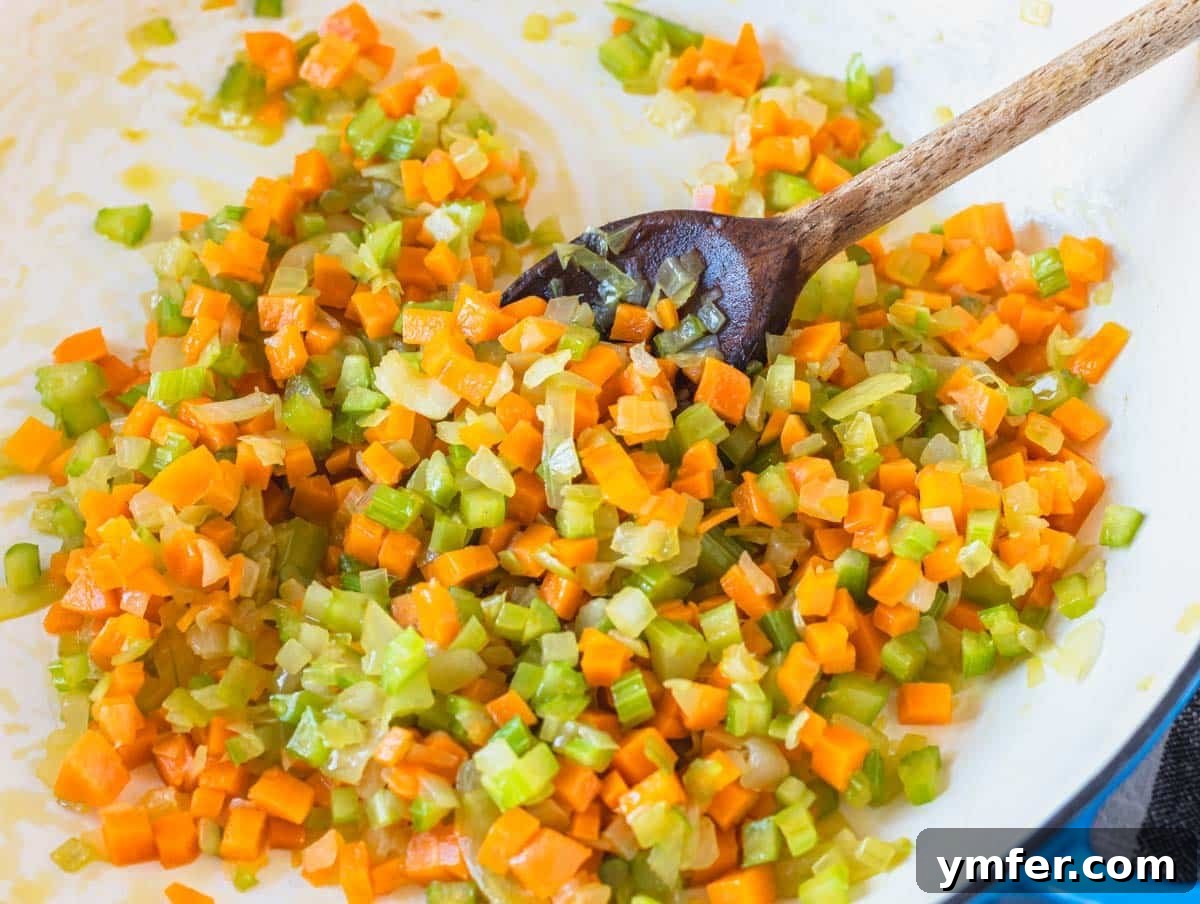 Flavorful Onion Dishes 5 Soffritto cooking gently in a blue skillet with a wooden spoon