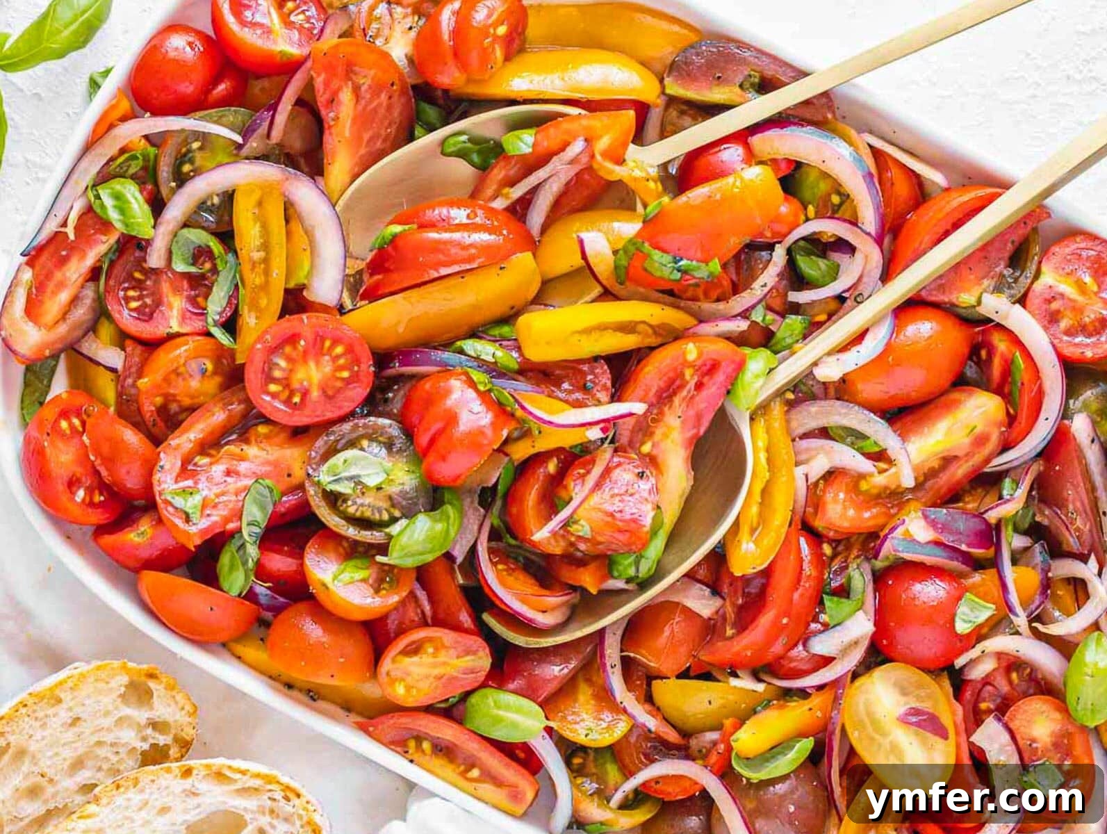 Flavorful Onion Dishes 6 Fresh tomato salad with red onions on a white platter