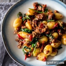 Smoky Chorizo Gnocchi with Roasted Red Pepper and Spinach 5 chorizo red pepper spinach gnocchi on a plate